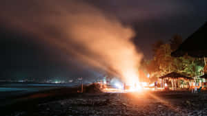 Warm Beach Bonfire On A Beautiful Evening Wallpaper