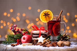 Warm, Inviting Glass Of Mulled Wine With Spices And Citrus Wallpaper