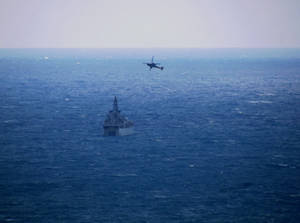 Warship Camouflaged In The Ocean Wallpaper