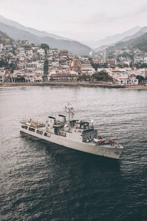 Warship On A Crowded City Wallpaper