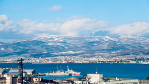 Warship On Picturesque Landscape Wallpaper