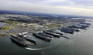 Warship On Vast Seaport Wallpaper