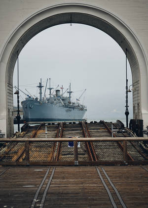 Warship Through An Arch Wallpaper