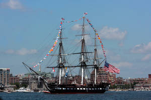 Warship With Colorful Flags Wallpaper