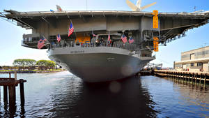 Warship With Flags Wallpaper