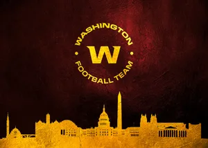 Washington Football Team In Action On A Vibrant Stadium Field Wallpaper