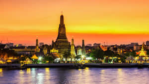 Wat Arun Under A Yellow Sky Wallpaper