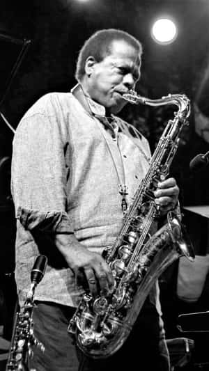 Wayne Shorter On Stage With His Saxophone Wallpaper