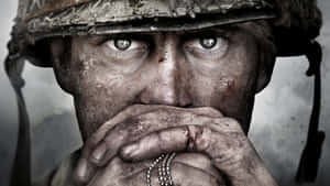 Weary Soldier Intense Gaze Wallpaper