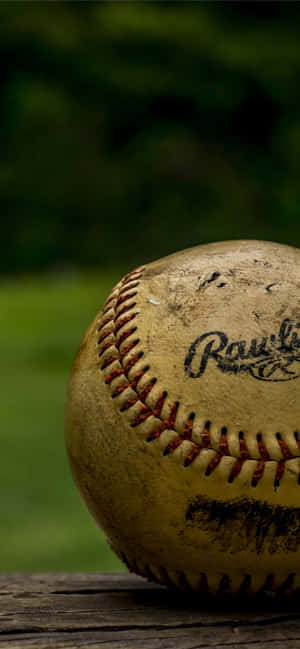 Weathered Softballon Wooden Surface Wallpaper