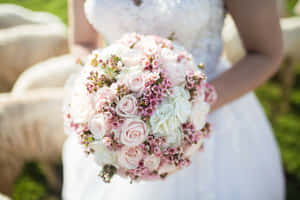 Wedding Bouquet In Bride's Hands Wallpaper