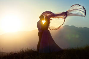 Wedding Couple Silhouette At Sunset Wallpaper