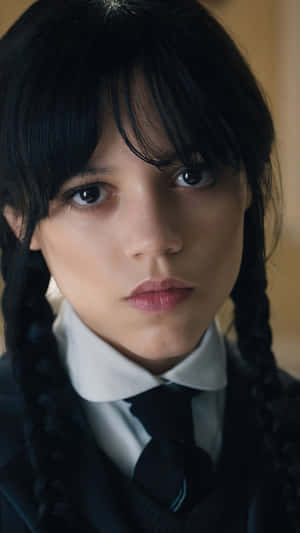 Wednesday Addams Intense Gaze Wallpaper