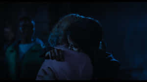 Wednesday Enid Embrace Dark Backdrop Wallpaper