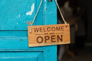 Welcome Sign On Teal Door Wallpaper