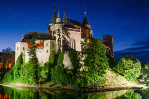 Well-lit Bojnice Castle Beneath Evening Sky Wallpaper