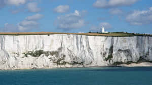 White Cliffs Of Dover Under The Cloudy Sky Wallpaper