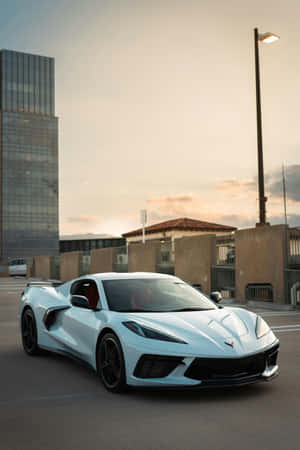 White Corvette C8 Urban Sunset Wallpaper