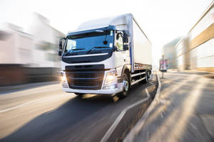 White Delivery Truck At Street Wallpaper