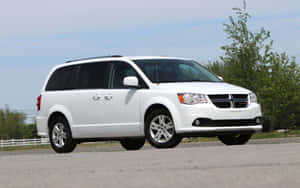 White Dodge Grand Caravan On Road Wallpaper