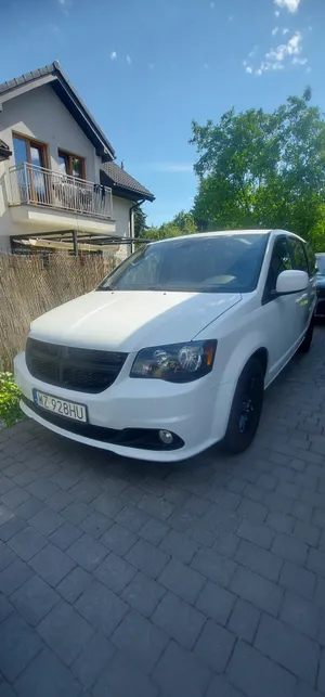 White Dodge Grand Caravan Residential Driveway Wallpaper