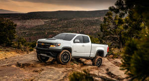 White Duramax Climbing Up A Mountain Wallpaper