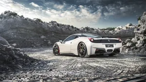 White Ferrari On Rocky Road Wallpaper