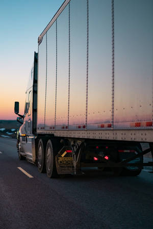 White Freight Truck At Sunset Wallpaper