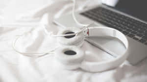 White Headphones Laptop Bedroom Setting Wallpaper