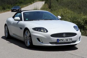 White Jaguar X K Convertible On Road Wallpaper