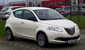 White Lancia Ypsilon Parked Outdoors Wallpaper