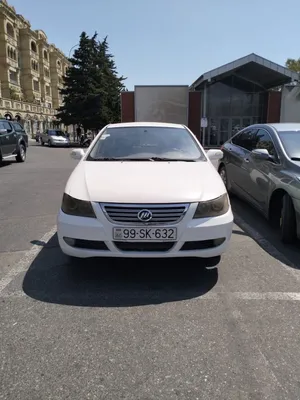 White Lifan620 Sedan Parked Outdoors Wallpaper