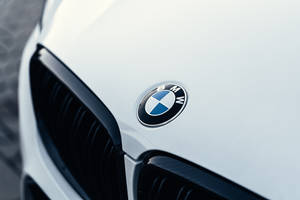 White Luxury Car Hood With Bmw Logo Wallpaper