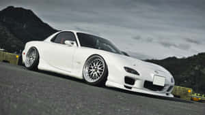 White Mazda Rx 7 Against Mountain Wallpaper