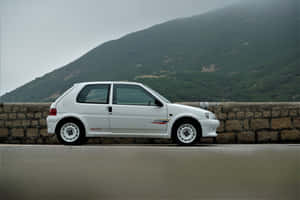 White Peugeot106 Side View Wallpaper