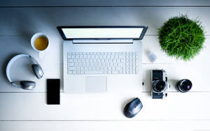 White Wooden Office Desk With Laptop Wallpaper