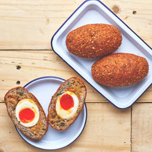 Whole And Half Scotch Eggs Flat Lay Shot Wallpaper