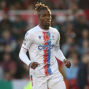 Wilfried Zaha Wearing White Football Uniform Wallpaper