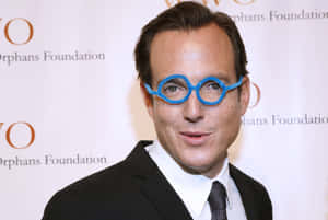 Will Arnett Striking A Pose In A Stylish Photoshoot. Wallpaper