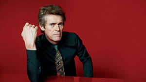 Willem Dafoe Red Backdrop Wallpaper