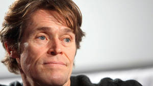 Willem Dafoe Staring Timidly Wallpaper