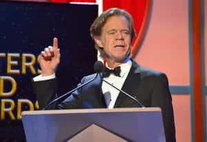William H. Macy At An Event, Posing With A Captivating Smile. Wallpaper