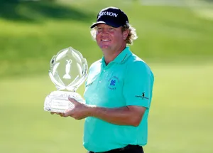 William Mcgirt Triumphantly Holding Championship Trophy Wallpaper