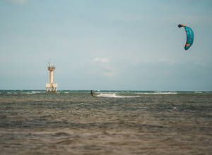 Windsurfing Near Lighthouse Wallpaper