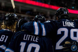 Winnipeg Jets Players Kyle Connor Bryan Little And Patrick Laine Wallpaper