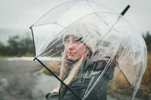 Winter Chic Girl With Clear Umbrella Wallpaper