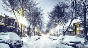 Winter Cityscape With Snowy Bridge And River Wallpaper