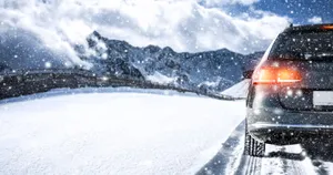 Winter Driving On Snowy Mountain Road Wallpaper