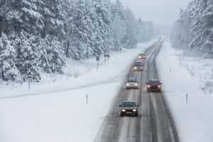 Winter Driving On Snowy Road Wallpaper