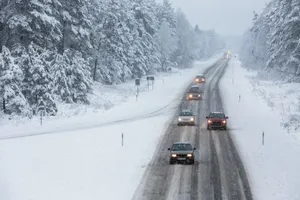 Winter Driving On Snowy Road Wallpaper